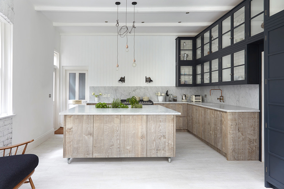 Inspiration for a transitional l-shaped kitchen in London with glass-front cabinets, blue cabinets, white splashback, with island and painted wood floors.