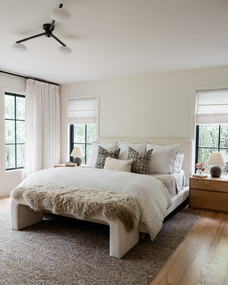 Example of a mid-sized transitional master light wood floor bedroom design in Chicago with white walls