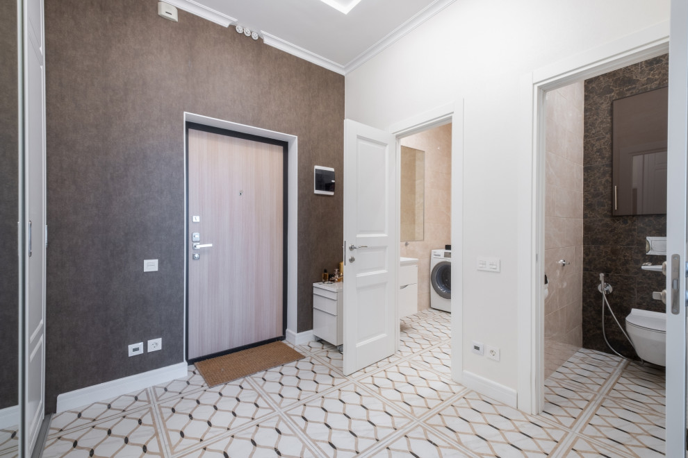 Design ideas for a small contemporary vestibule in Saint Petersburg with white walls, porcelain floors and white floor.