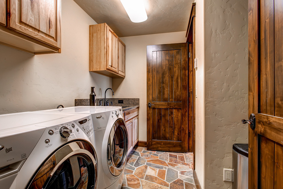 This is an example of a traditional laundry room in Denver.