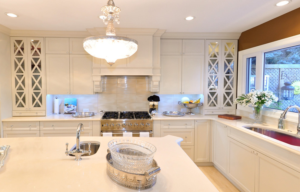 Example of a transitional kitchen design in Calgary
