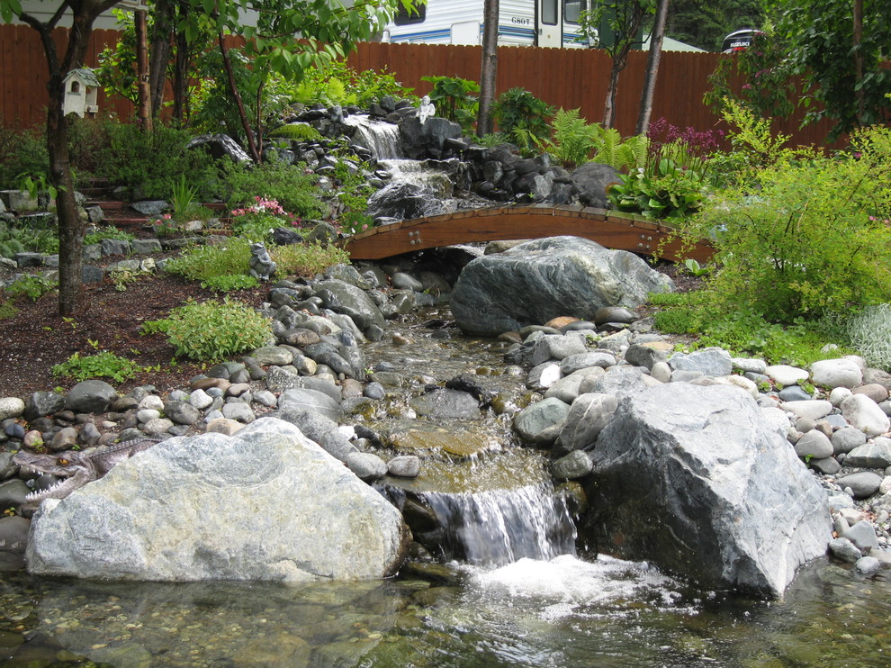 Design ideas for a large transitional full sun backyard pond.
