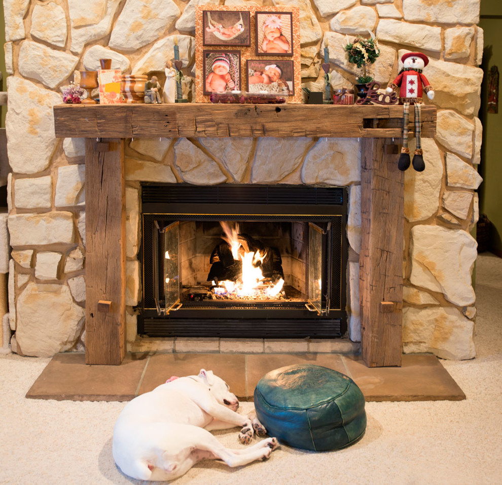 Inspiration for a mid-sized timeless carpeted living room remodel in Cleveland with a standard fireplace and a stone fireplace