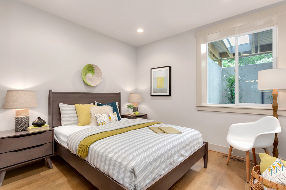 Large minimalist guest carpeted and gray floor bedroom photo in Seattle with beige walls