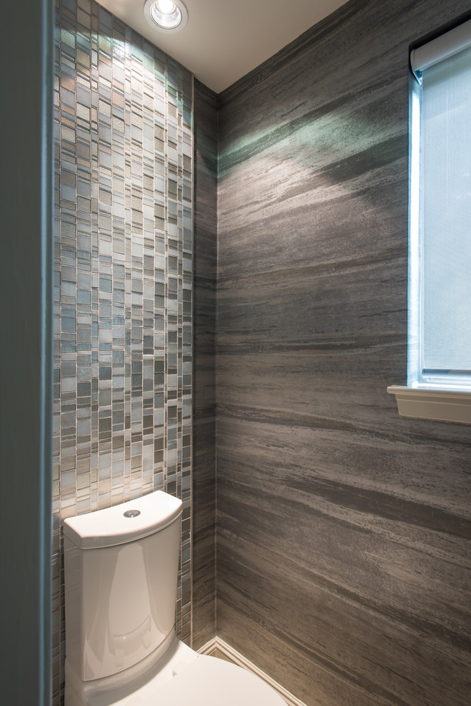 Inspiration for a large contemporary bathroom in Dallas with flat-panel cabinets, medium wood cabinets, a drop-in tub, a one-piece toilet, gray tile, porcelain tile, grey walls, marble floors, an undermount sink and marble benchtops.