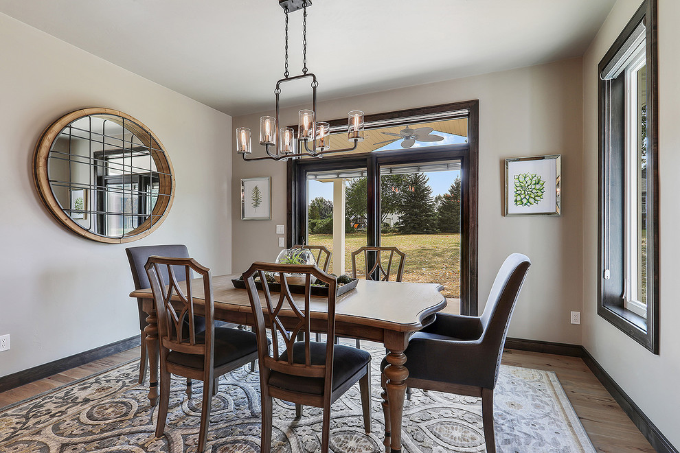 Enclosed dining room - mid-sized traditional brown floor and dark wood floor enclosed dining room idea with gray walls and no fireplace