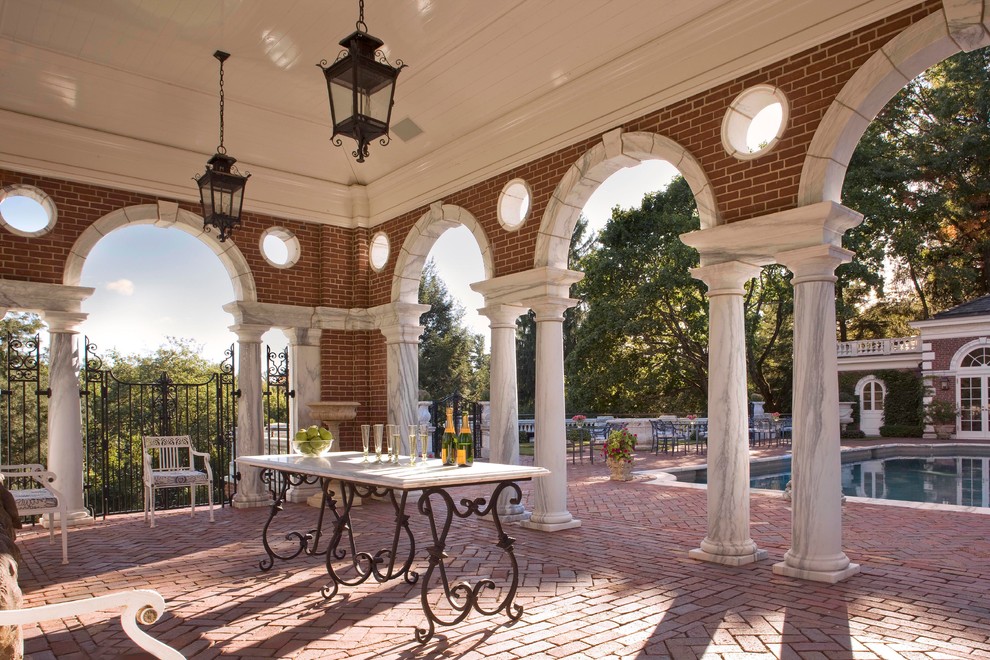 Large traditional patio in Boston with brick pavers and a gazebo/cabana.