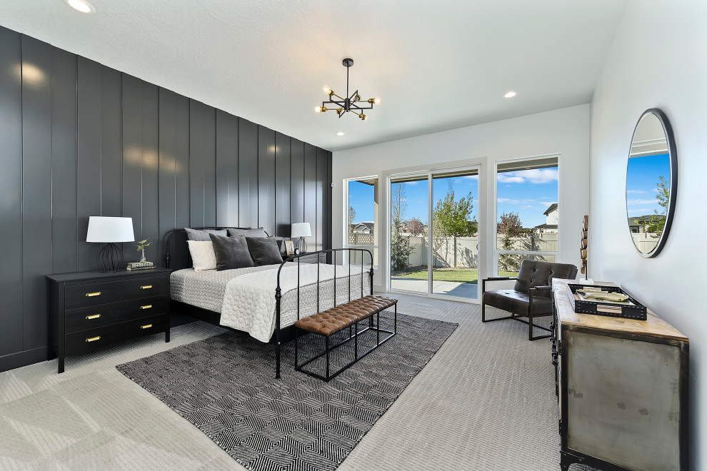 Mid-sized transitional master bedroom in Boise with black walls, carpet, no fireplace, beige floor and panelled walls.