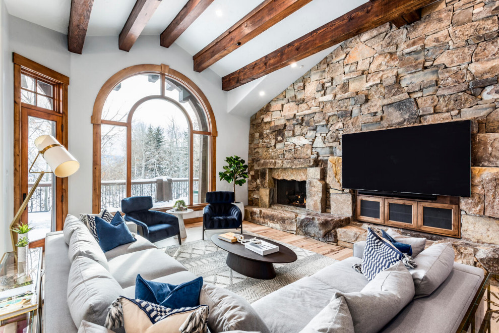 Living room - large contemporary formal and open concept beige floor, exposed beam and light wood floor living room idea in Salt Lake City with multicolored walls, a standard fireplace, a stone fireplace and a wall-mounted tv