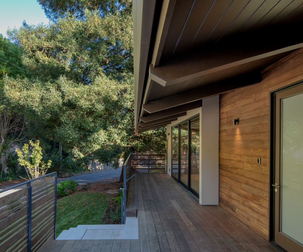 Mid-sized modern two-storey brown house exterior in San Francisco with wood siding, a gable roof and a metal roof.