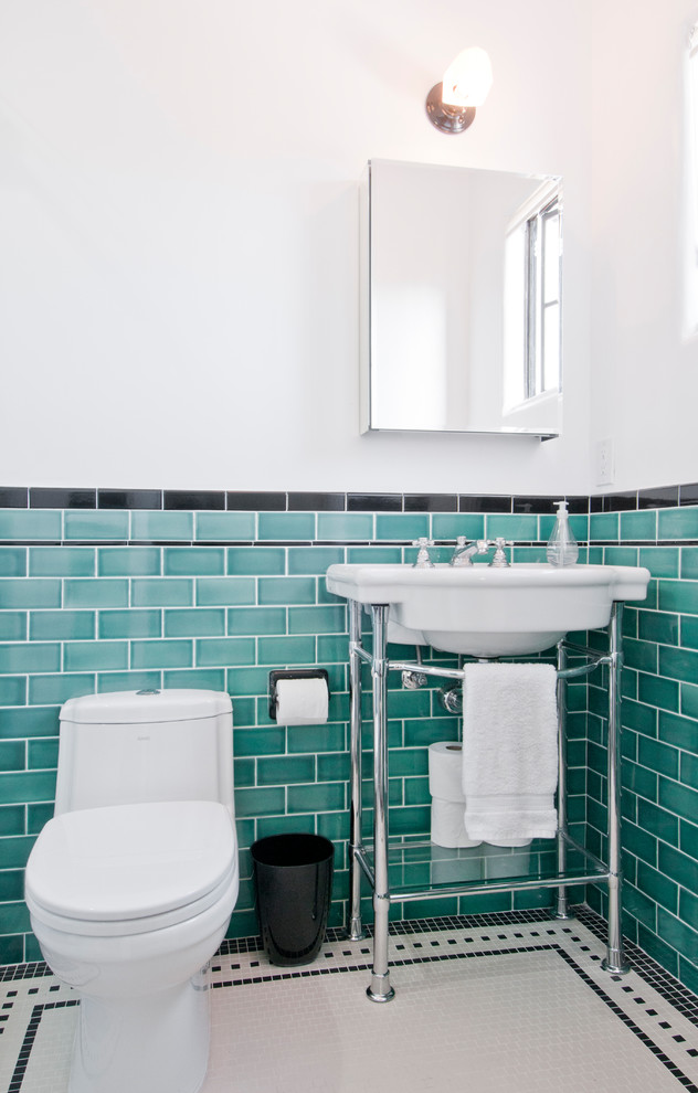 This is an example of a small eclectic bathroom in Los Angeles with an alcove shower, a two-piece toilet, blue tile, ceramic tile, white walls, mosaic tile floors, a pedestal sink, multi-coloured floor and a sliding shower screen.