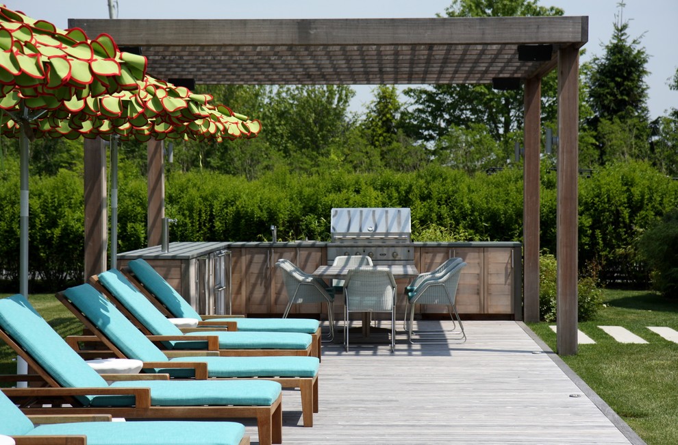 Photo of a country deck in New York with a pergola.