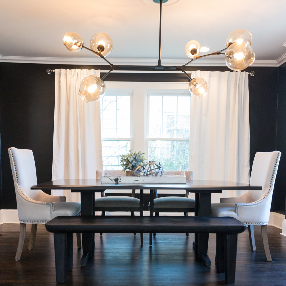 Contemporary dining room in Columbus with black walls.