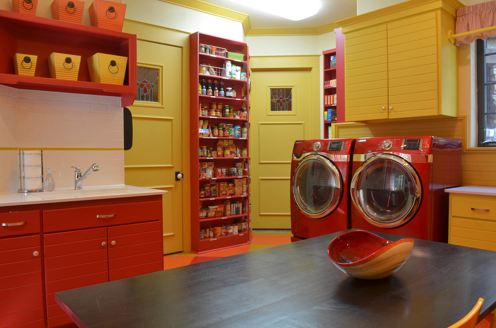 Design ideas for a traditional laundry room in Dallas with red cabinets.