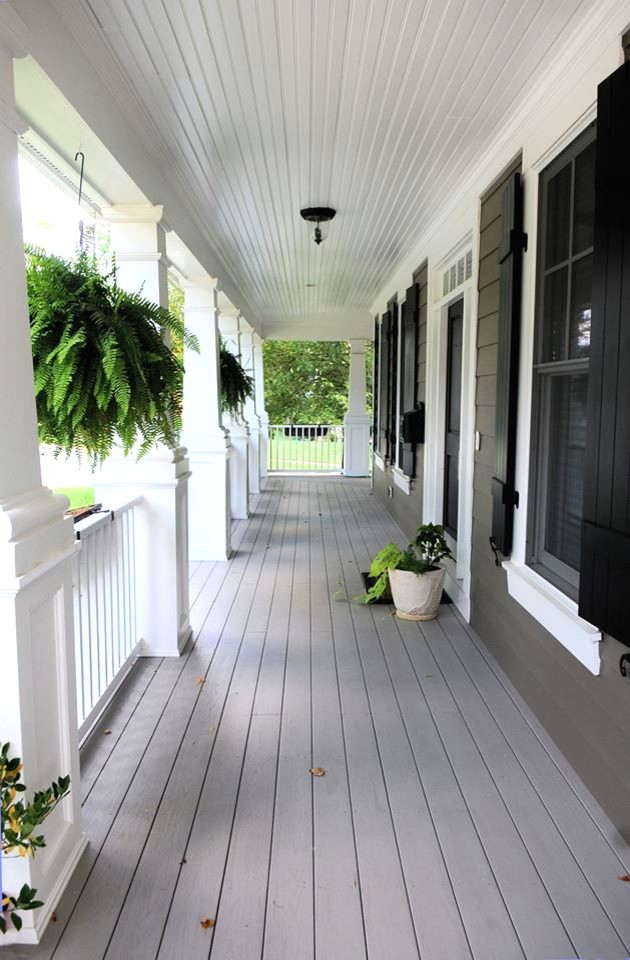 Inspiration for a large craftsman front porch remodel in DC Metro with decking and a roof extension