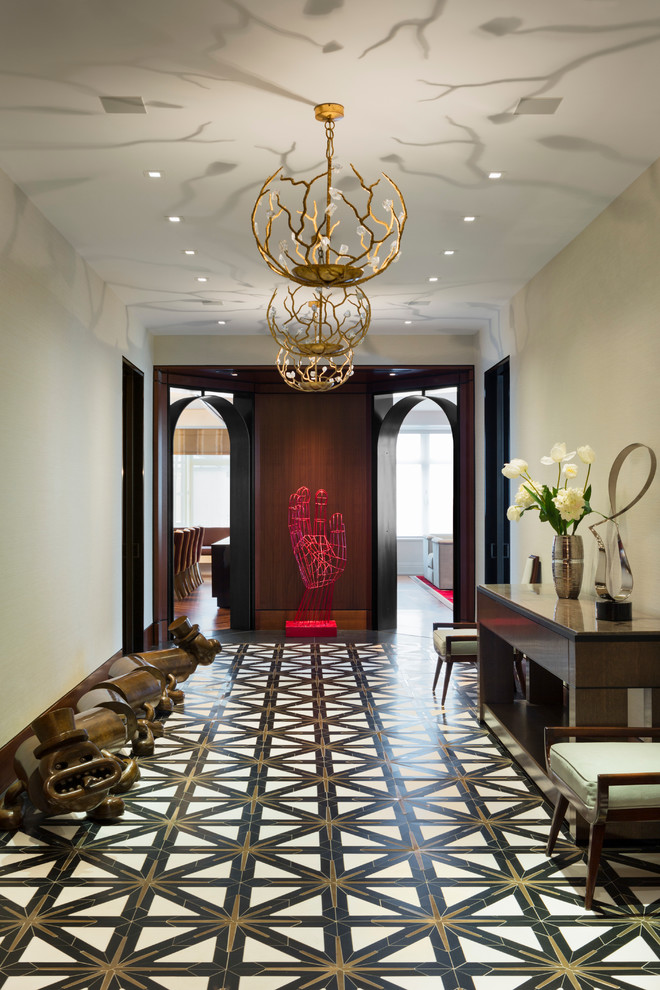Design ideas for an expansive contemporary hallway in New York with beige walls, marble floors and black floor.