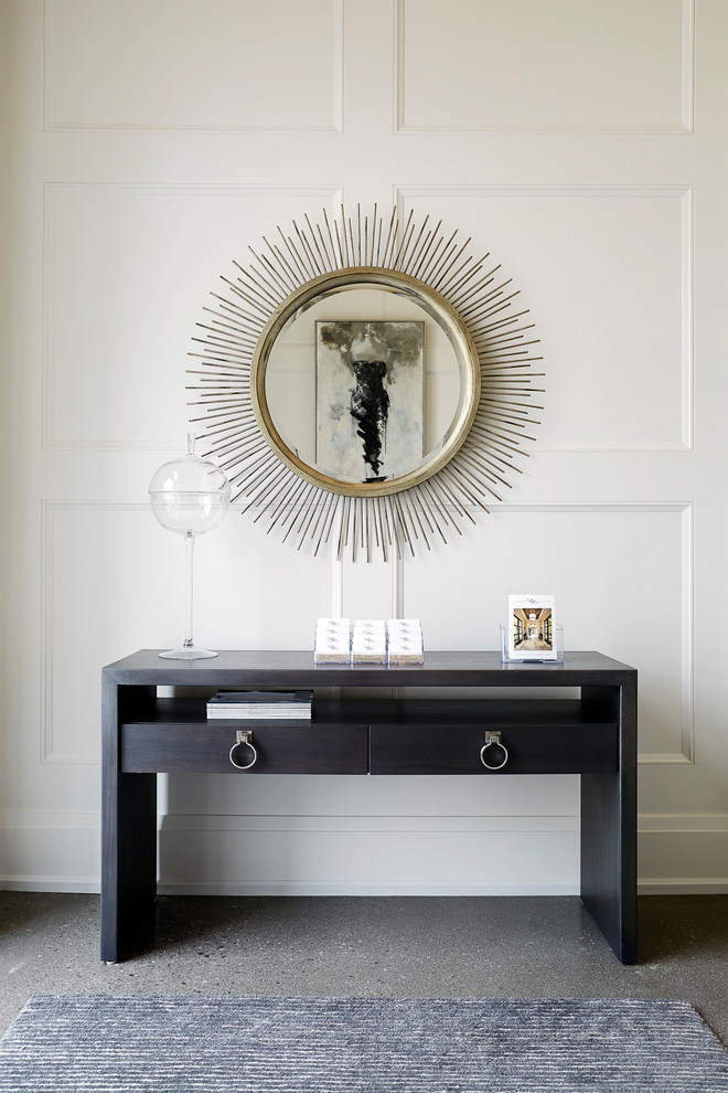 Inspiration for a large transitional concrete floor foyer remodel in Toronto with white walls