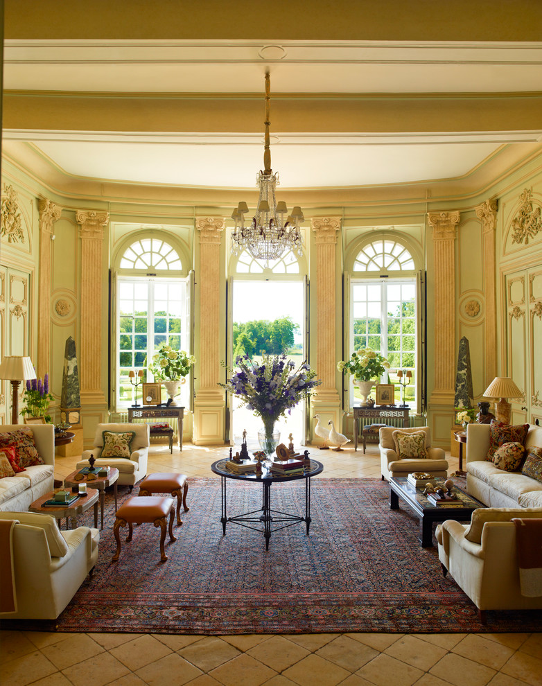 Inspiration for a large traditional formal enclosed living room in Los Angeles with green walls, terra-cotta floors, no fireplace and no tv.