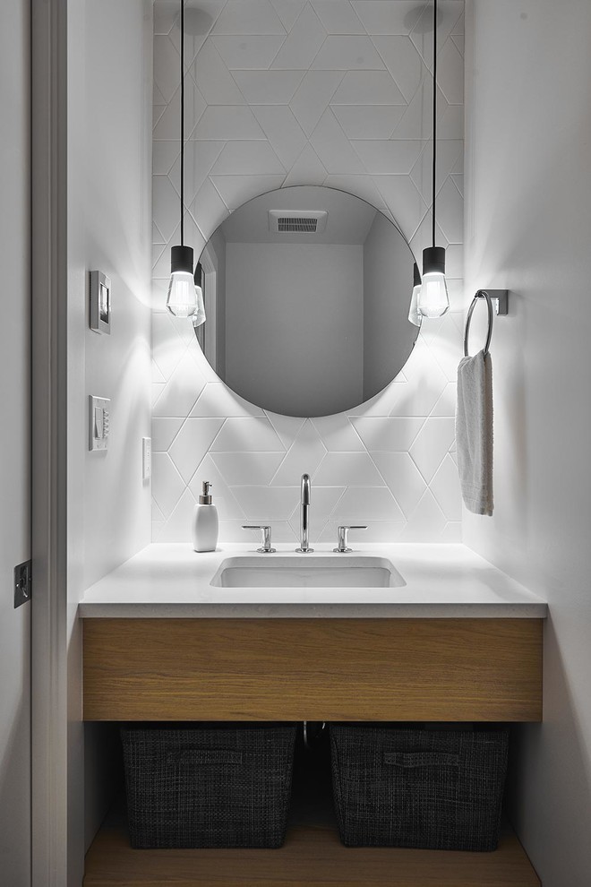 This is an example of a small scandinavian 3/4 bathroom in Vancouver with flat-panel cabinets, brown cabinets, a one-piece toilet, white tile, ceramic tile, white walls, an undermount sink, engineered quartz benchtops and white benchtops.