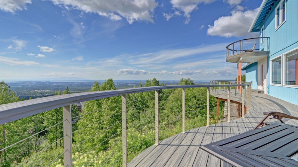 Example of a large side yard second story cable railing deck design with no cover