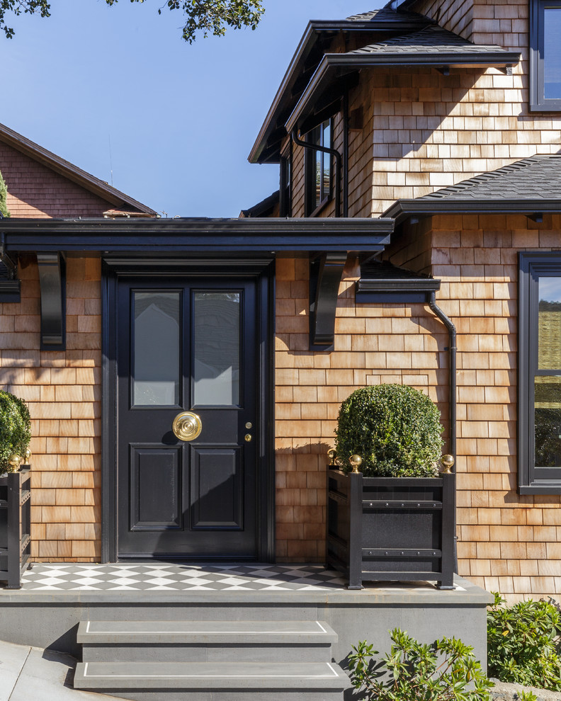 Example of a large classic two-story wood exterior home design in San Francisco with a hip roof