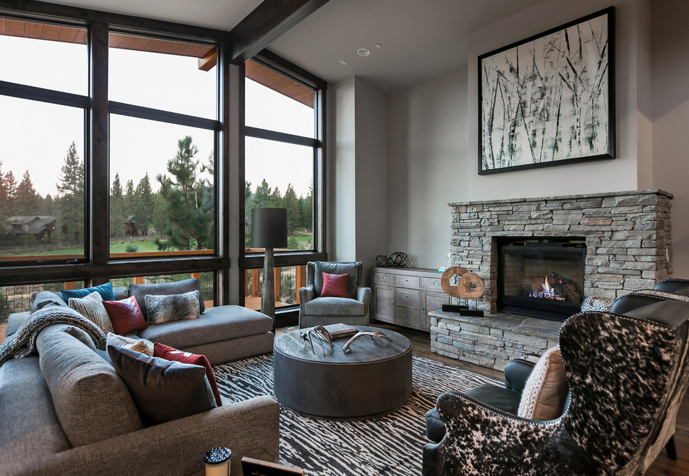 Large country formal open concept living room in Sacramento with grey walls, carpet, a standard fireplace, a stone fireplace surround and no tv.