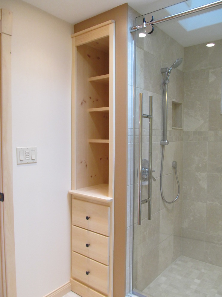 Photo of a small country master bathroom in Other with beige tile, stone tile, raised-panel cabinets, beige cabinets, an alcove shower, a one-piece toilet, beige walls, limestone floors, an integrated sink, laminate benchtops, beige floor and a sliding shower screen.