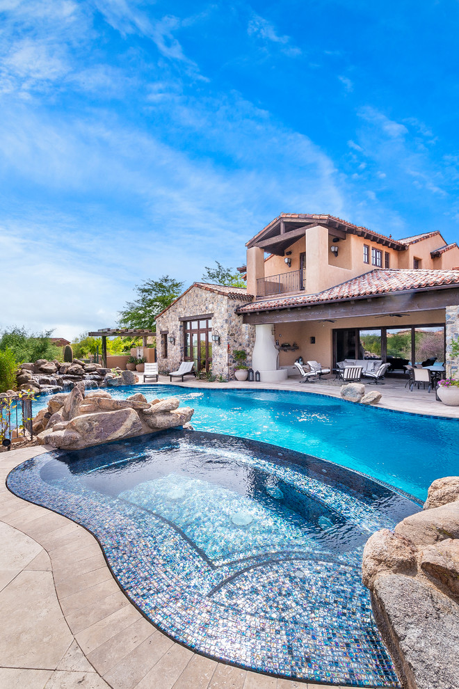 Inspiration for a rustic pool remodel in Phoenix