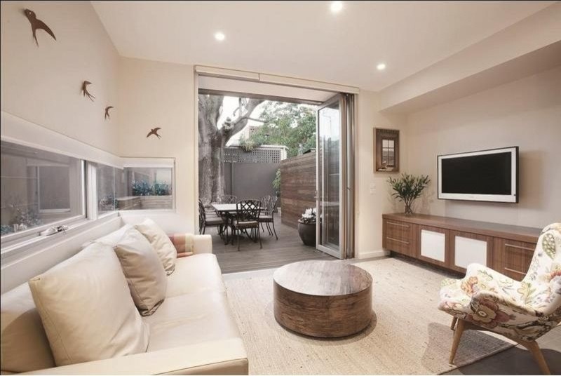 Design ideas for a mid-sized contemporary open concept living room in Melbourne with white walls, ceramic floors, no fireplace and a wall-mounted tv.