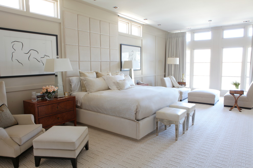 Inspiration for a large transitional master carpeted bedroom remodel in Calgary with white walls and no fireplace