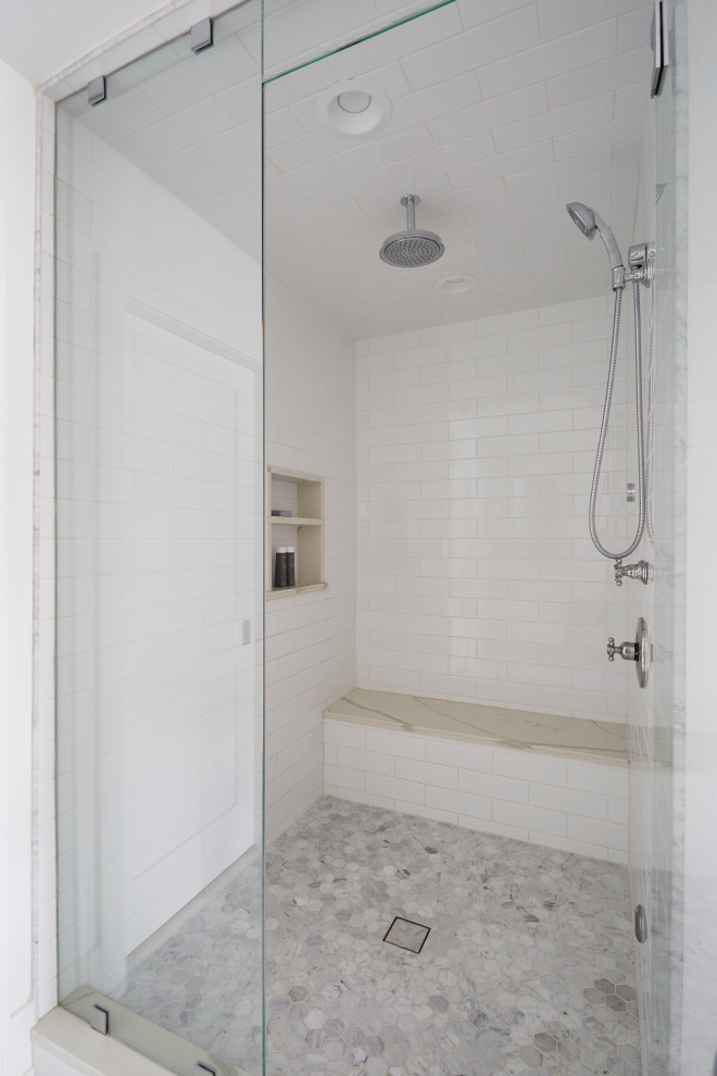Design ideas for a large farmhouse ensuite bathroom in Chicago with recessed-panel cabinets, white cabinets, an alcove shower, a two-piece toilet, white tiles, ceramic tiles, white walls, marble flooring, a submerged sink, engineered stone worktops, grey floors, a hinged door, white worktops, double sinks and a built in vanity unit.