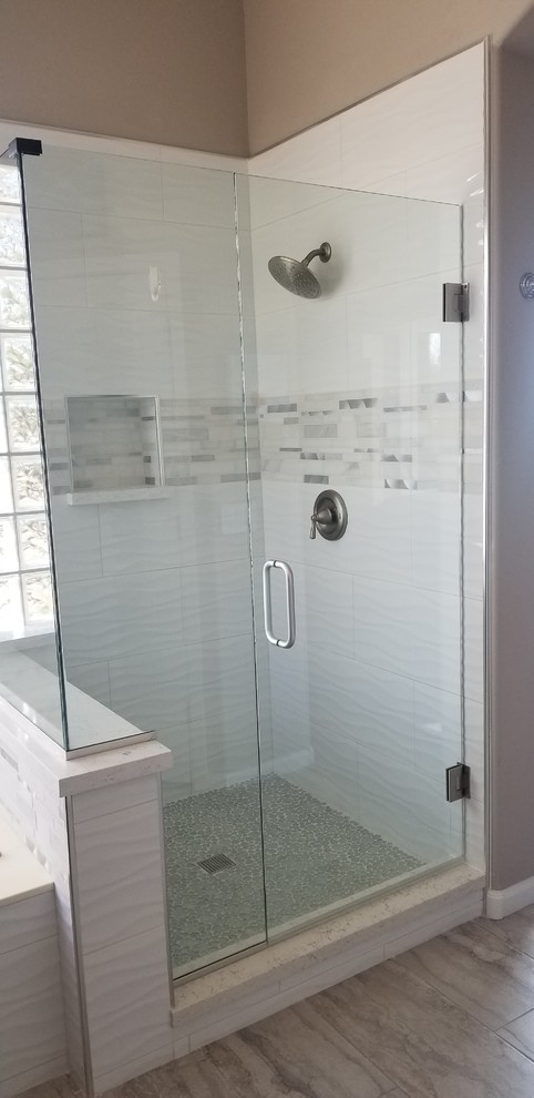 Inspiration for a transitional laminate floor and gray floor doorless shower remodel in Phoenix with an undermount tub and a hinged shower door