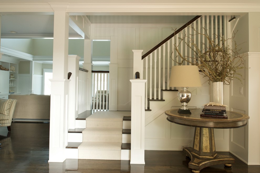 Inspiration for a mid-sized traditional wood l-shaped staircase in Boston with painted wood risers.
