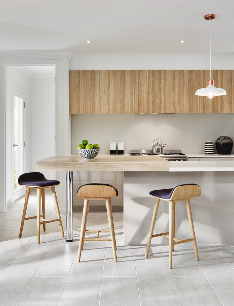Inspiration for a mid-sized contemporary galley eat-in kitchen in Melbourne with an undermount sink, light wood cabinets, quartz benchtops, beige splashback, glass sheet splashback, stainless steel appliances, porcelain floors and with island.