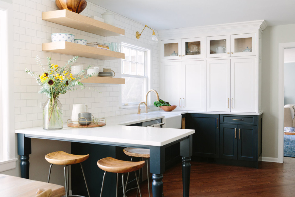 Kitchen - transitional kitchen idea in Chicago with a farmhouse sink, shaker cabinets, blue cabinets, white backsplash, marble backsplash and stainless steel appliances