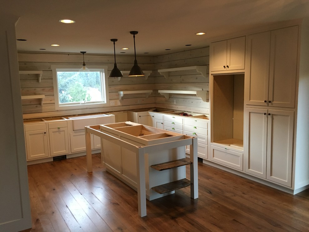 Example of a transitional kitchen design in Denver