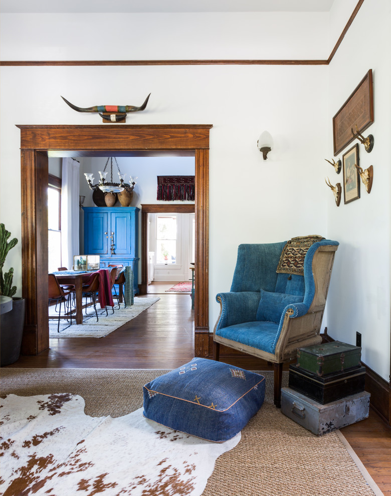 Mid-sized southwest formal and enclosed medium tone wood floor and brown floor living room photo in Houston