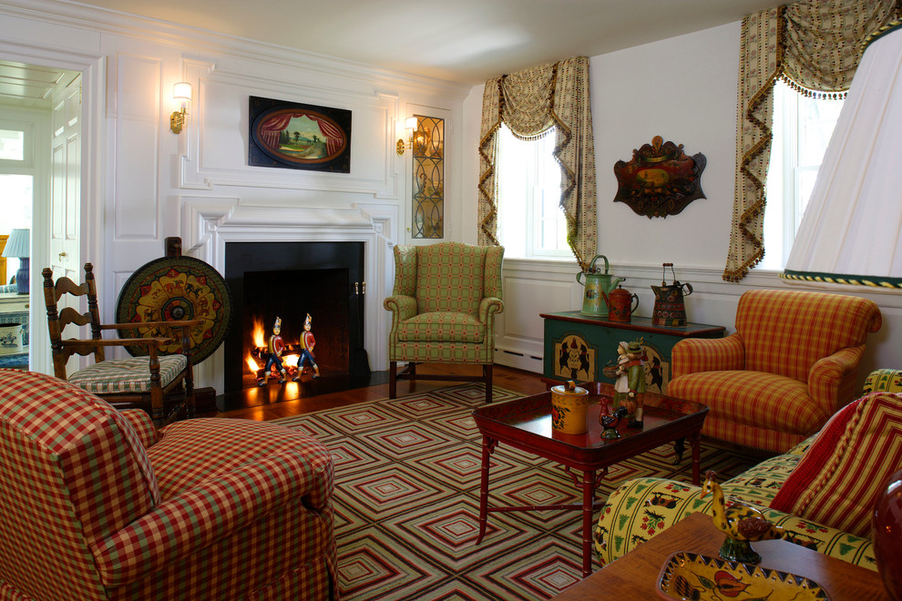 This is an example of a country formal enclosed living room in Philadelphia with white walls, a standard fireplace and no tv.