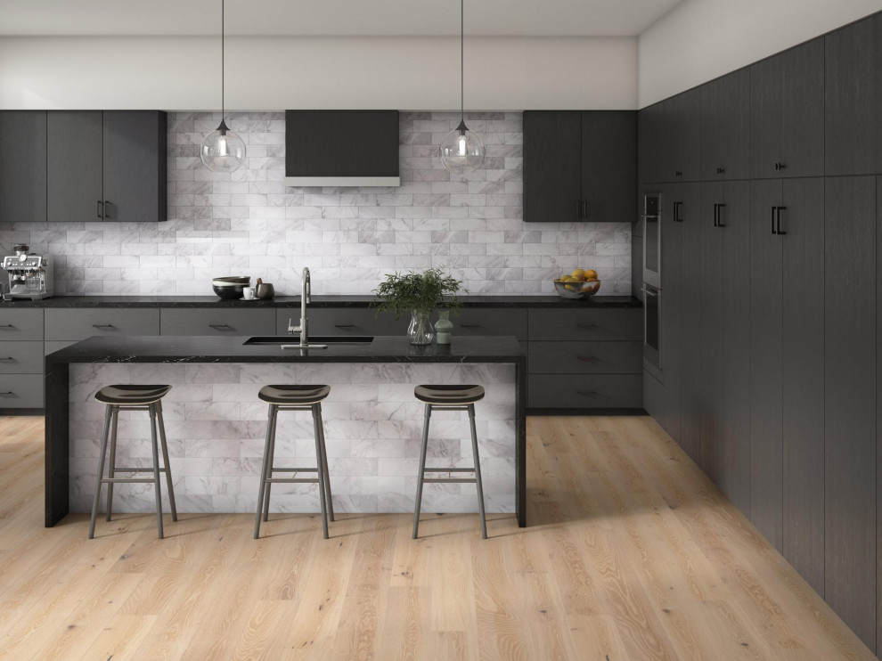 Inspiration for a mid-sized modern u-shaped laminate floor and brown floor open concept kitchen remodel in Houston with a drop-in sink, louvered cabinets, black cabinets, quartzite countertops, gray backsplash, glass tile backsplash, black appliances, an island and black countertops