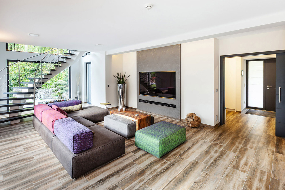 This is an example of a large eclectic open concept living room in Dortmund with white walls, no fireplace, a built-in media wall and dark hardwood floors.