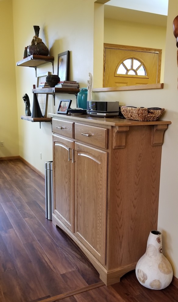 Example of a transitional kitchen design with wood countertops