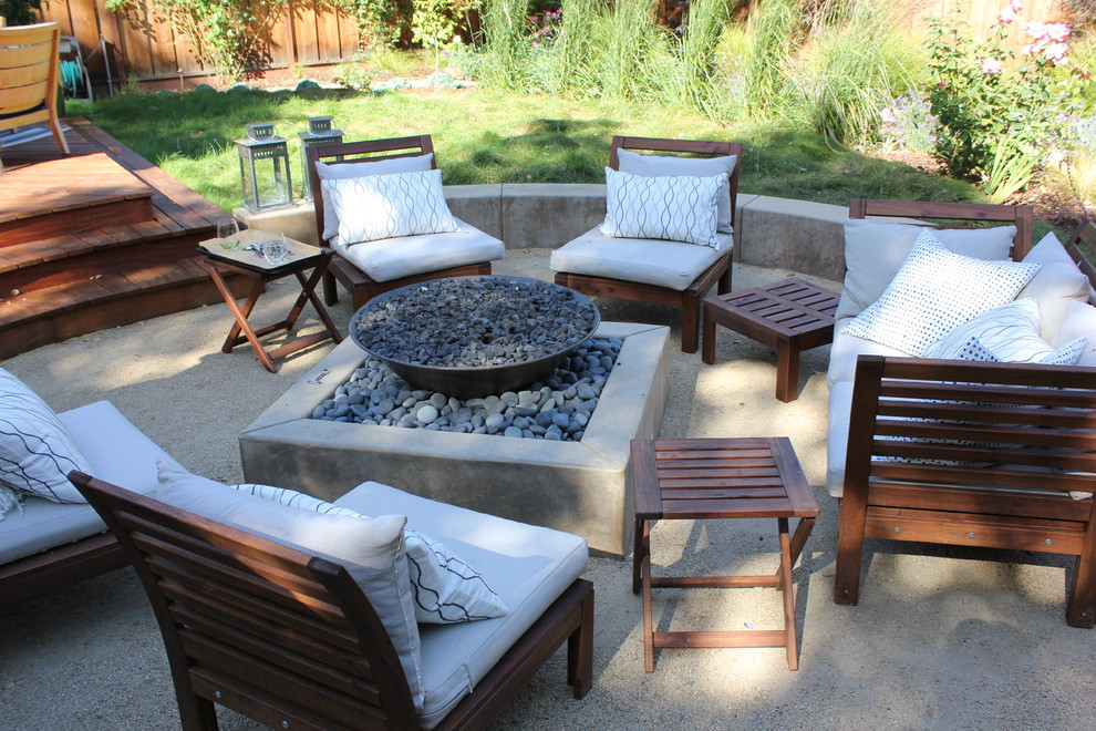 Photo of a mid-sized contemporary backyard patio in San Francisco with a fire feature, decomposed granite and no cover.