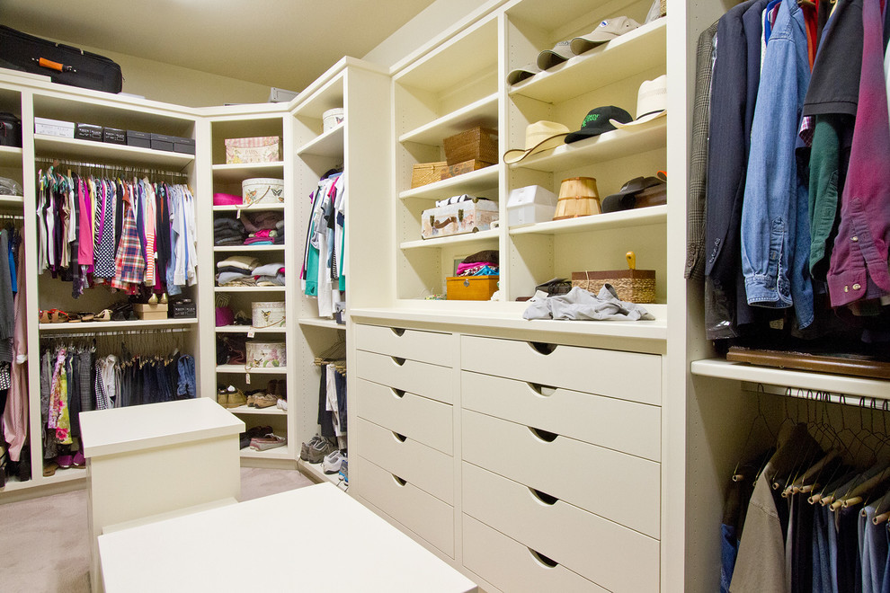 Photo of a large arts and crafts gender-neutral dressing room in Dallas with flat-panel cabinets, white cabinets and carpet.