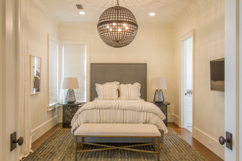 Photo of a beach style bedroom in Miami with white walls, dark hardwood floors and no fireplace.