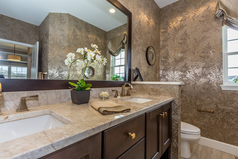 Transitional master ceramic tile and beige floor bathroom photo with shaker cabinets, dark wood cabinets, a one-piece toilet, beige walls, an undermount sink and quartzite countertops