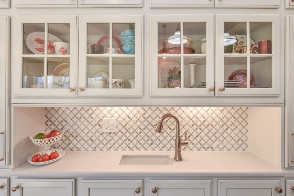 Inspiration for a large transitional u-shaped kitchen remodel in DC Metro with a farmhouse sink, recessed-panel cabinets, quartz countertops, stainless steel appliances and an island