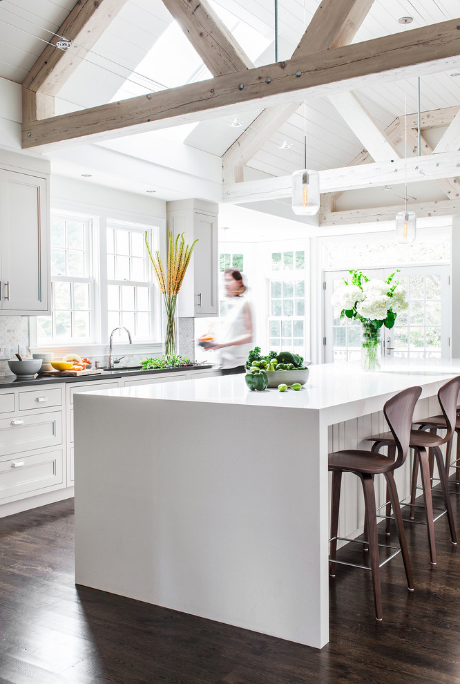 Example of a transitional kitchen design in Boston with recessed-panel cabinets, white cabinets, white backsplash and white walls