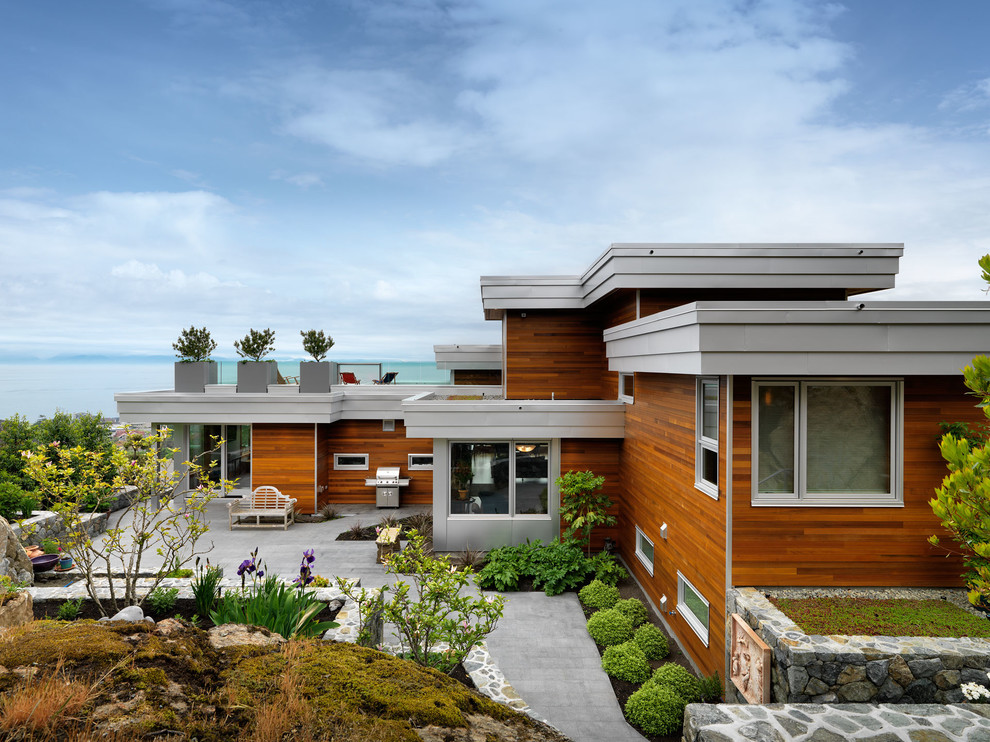 Photo of a contemporary exterior in Vancouver with wood siding.