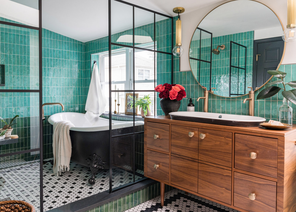 Inspiration for a mid-sized transitional master bathroom in Chicago with flat-panel cabinets, medium wood cabinets, a claw-foot tub, a shower/bathtub combo, green tile, porcelain tile, white walls, porcelain floors, a drop-in sink, wood benchtops, black floor, an open shower, brown benchtops, a niche, a double vanity and a freestanding vanity.