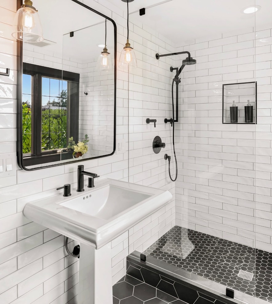 Photo of a small transitional 3/4 bathroom in Seattle with an open shower, white tile, ceramic tile, ceramic floors, a pedestal sink, black floor and an open shower.